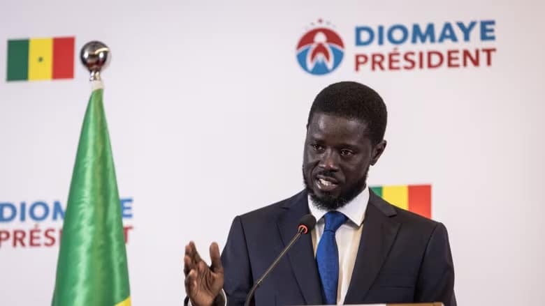 Senegalese president-elect Bassirou Diomaye Faye gestures in Dakar on Monday as he addresses his first press conference after being declared winner of the country's election. (John Wessels/AFP/Getty Images)